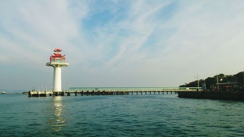 Tower in sea at ko sichang against sky