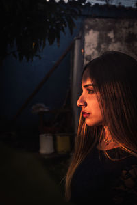 Portrait of young woman looking away