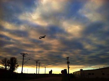 Low angle view of cloudy sky at sunset