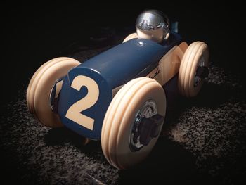 Close-up of toy car against black background