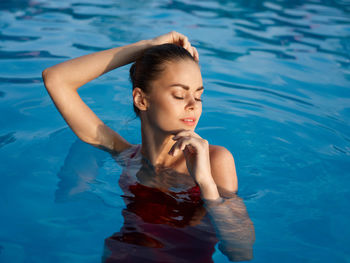 High angle view of woman swimming in pool