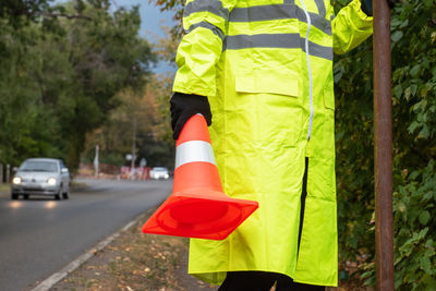 Rear view of man standing on road