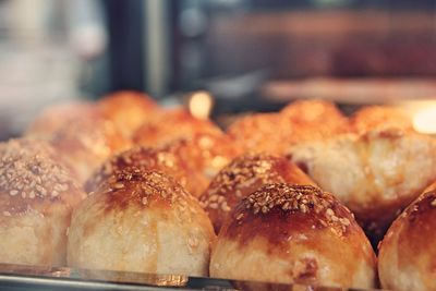 Close-up of puff pastries at window display