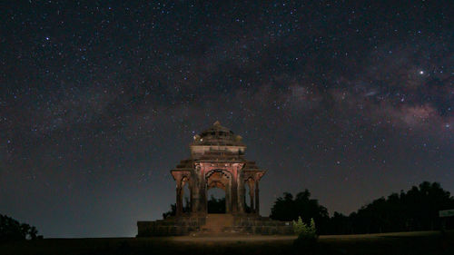 Low angle view of building against sky at night