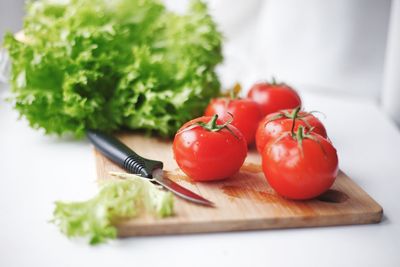 Close-up of tomatoes on cutting board