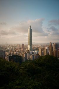 Modern buildings in city against sky