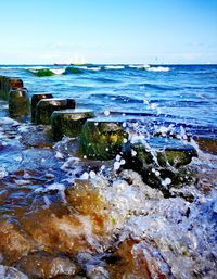 Scenic view of sea against blue sky