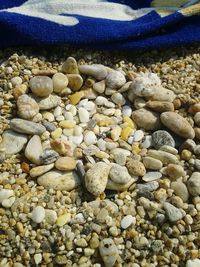 High angle view of pebbles at beach