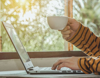 Man using laptop on table