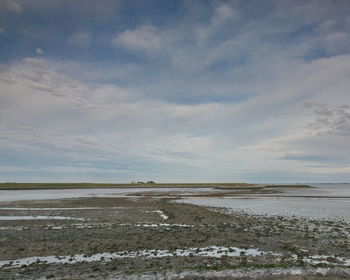 Scenic view of beach against sky