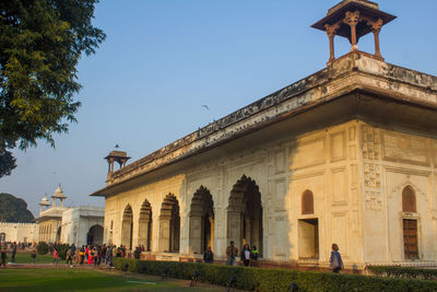 Group of people in front of historical building