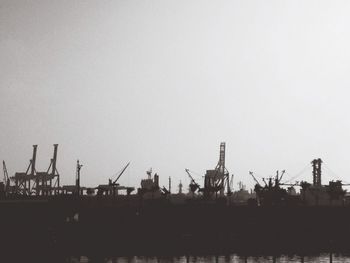 Silhouette of cranes at commercial dock