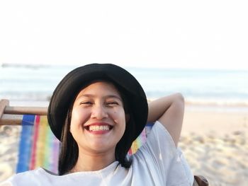 Portrait of a smiling young woman on beach