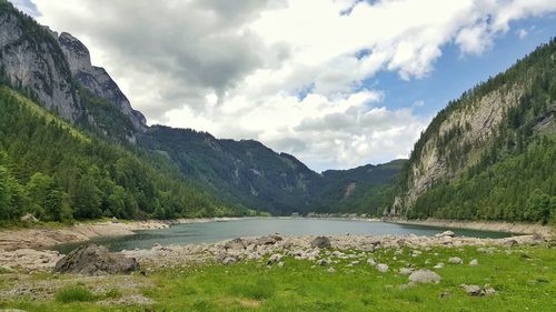 Scenic view of lake and mountains against sky