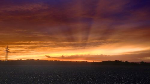 Scenic view of dramatic sky during sunset