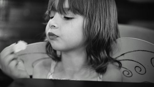 Close-up of girl with wings