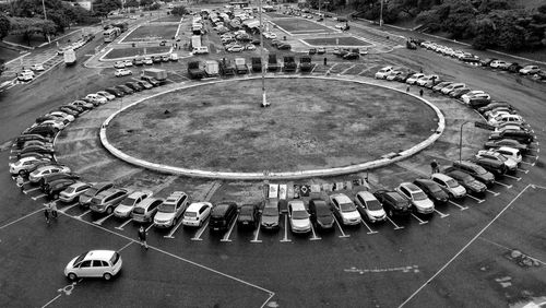 High angle view of group of cars parked in circle