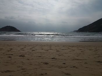 Scenic view of beach against sky