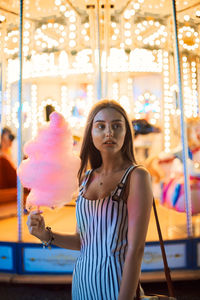 Portrait of young woman in amusement park