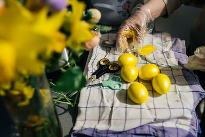 Cropped hand of woman picking tomatoes