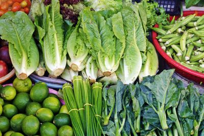 High angle view of fresh vegetables arranged in market for sale