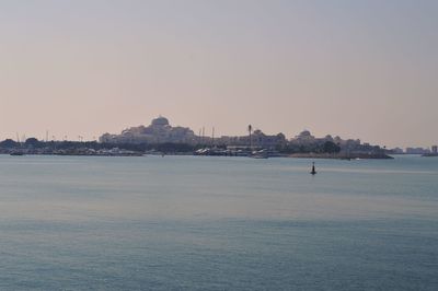 Scenic view of sea against clear sky during sunset