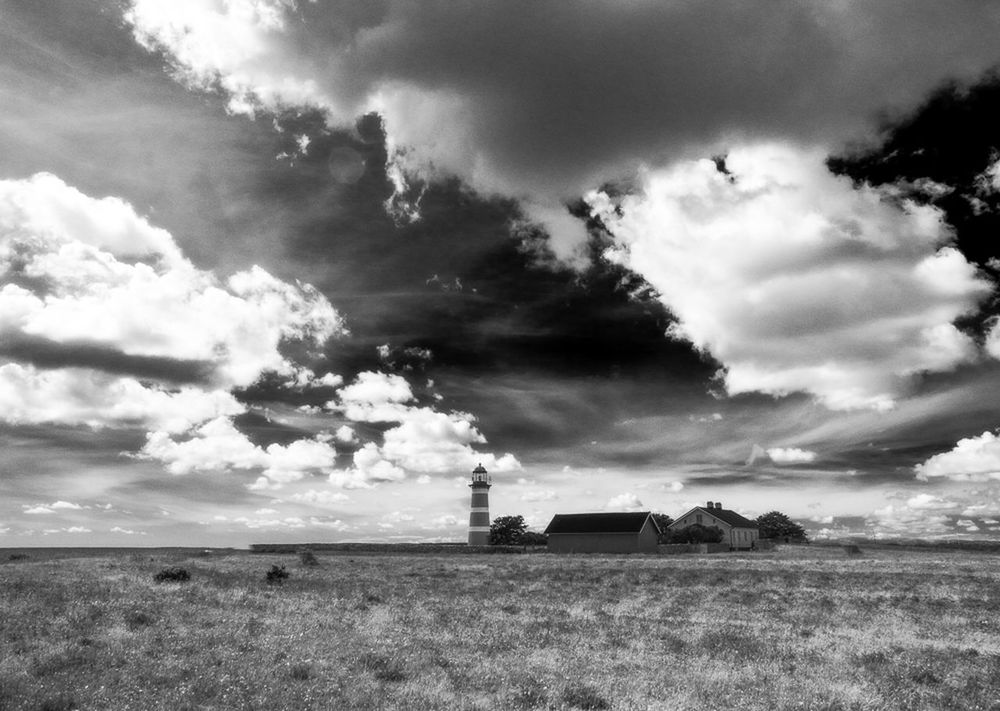 sky, field, cloud - sky, landscape, rural scene, cloudy, built structure, building exterior, architecture, cloud, agriculture, farm, grass, nature, tranquil scene, tranquility, fuel and power generation, day, no people, outdoors