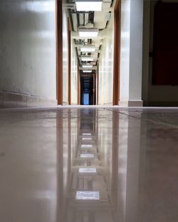 Empty narrow corridor along walls