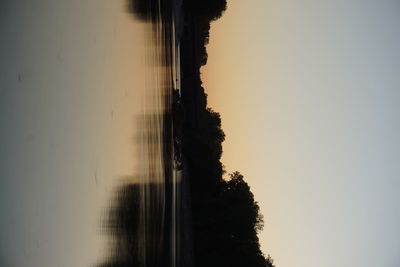 Scenic view of silhouette trees against sky during sunset