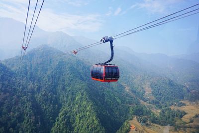 Overhead cable car against mountains