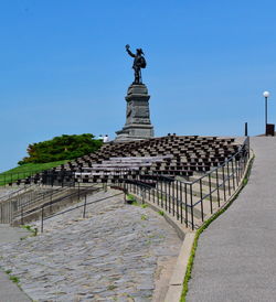 A statue at the top of a hill