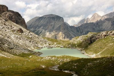 Scenic view of lake and mountains against sky