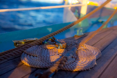 Close-up of rope tied on wooden table