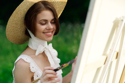 Young woman wearing hat