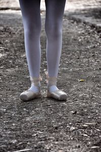 Low section of man standing outdoors