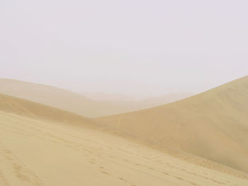 Scenic view of desert against clear sky