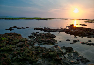 Scenic view of sea against sky during sunset