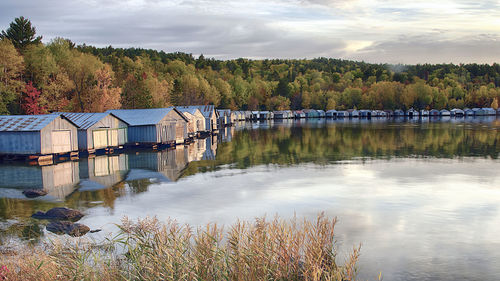 Scenic view of  boathouses  on lakeshore  