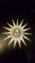 Close-up of clock on black background