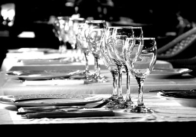 Close-up of wine glasses on table