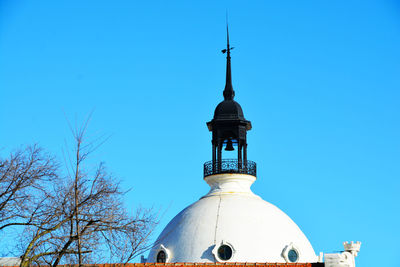 Low angle view of building against blue sky