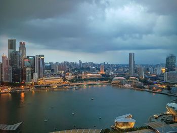 High angle view of cityscape against cloudy sky