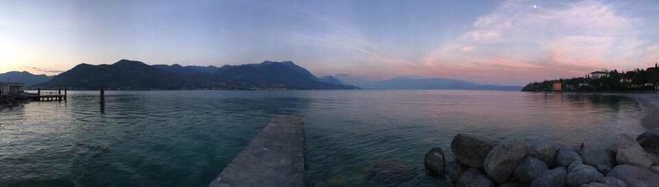 PANORAMIC SHOT OF LAKE AGAINST DRAMATIC SKY