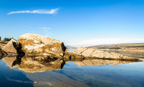 Scenic view of mountain against blue sky