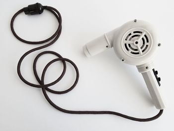 High angle view of hair dryer on white background