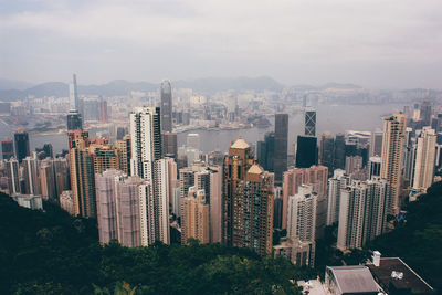 High angle view of modern buildings against sky in city