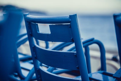 Close-up of empty chairs on table