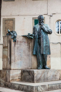 Low angle view of statue against building