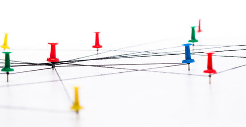 Close-up of telephone pole against white background