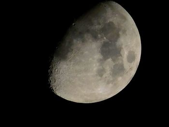 Low angle view of moon against clear sky at night